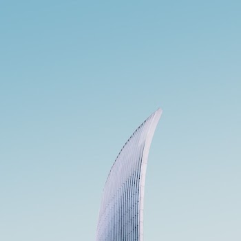 high-rise building under clear blue sky