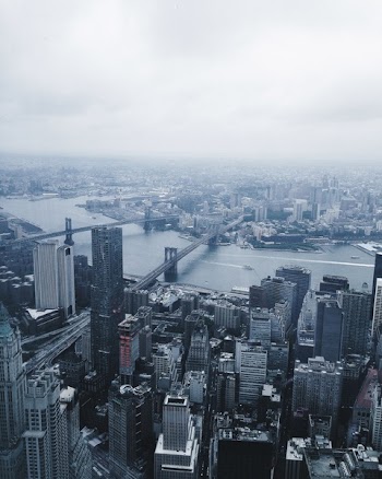 High Rise Building Under Grey Sky at Daytime
