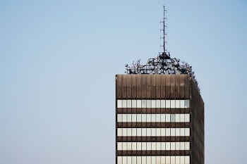 high-rise building under white sky
