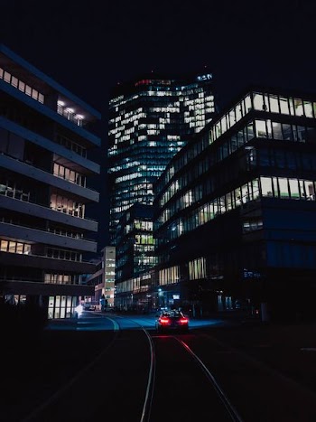 high rise buildings photo during nighttime