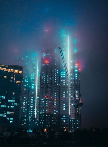 high rise buildings with lights illustration