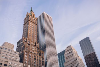 high-rise concrete buildings under blue sky