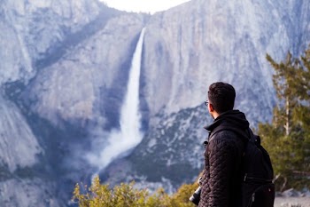 Hiker Views Waterfalls