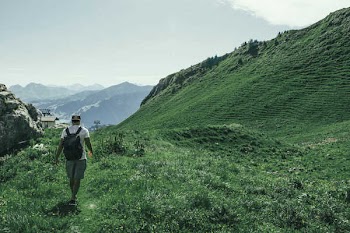 Hiking Green Hills of the Swiss Alps