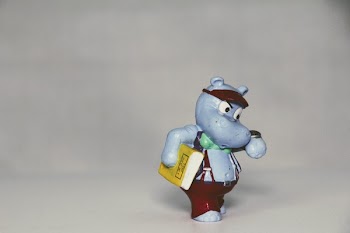Hippopotamus Holding Book Mini Figure