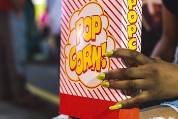 Holding Box Of Popcorn