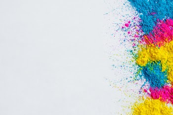 Holi color background on white background Free Photo