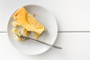 Homemade cheesecake on white plate