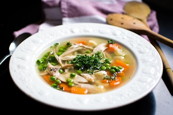 Homemade chicken broth with vegetables 