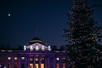 House by Christmas Tree during Nighttime