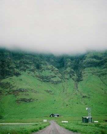 House Near Green and Brown Mountain