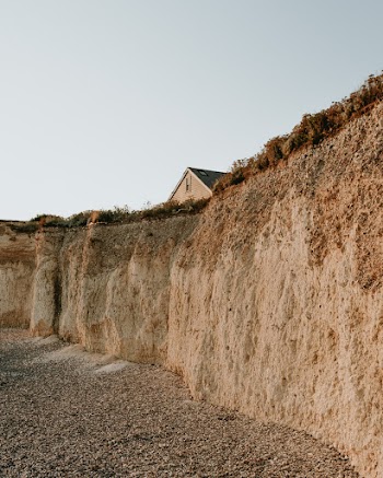 House Near Rocky Cliff