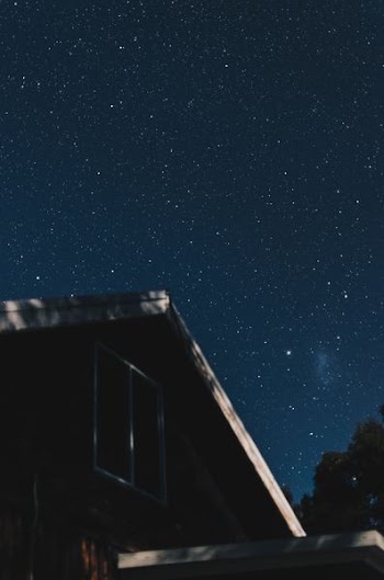 house under starry sky
