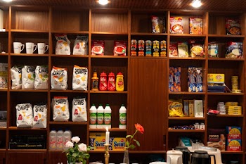 Household items on Brown Wooden Shelf