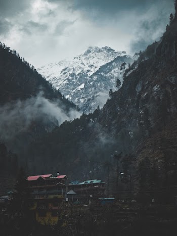 Houses at the Bottom of a Mountain