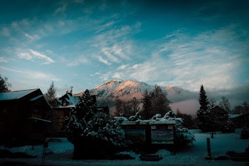 Houses Near Snow Caped Mountain