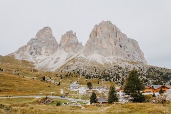 houses under gray rock formations