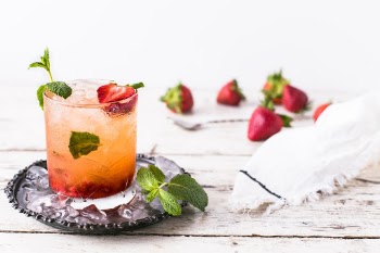 How about a Whiskey Smash? This one is made with muddled strawberries and mint. 