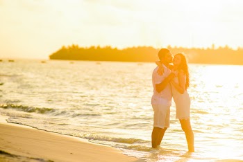 Hugging Woman and Man in Beach