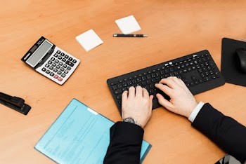 Human Hand on Computer Keyboard