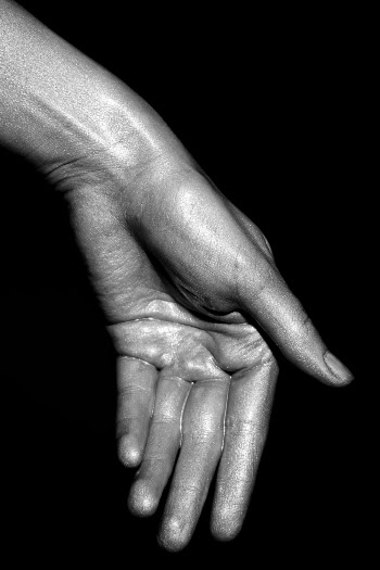 Human Hand With Silver Paint