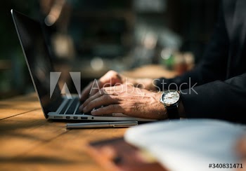 Human hand working with laptop networking technology