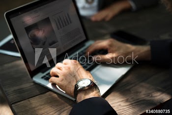 Human hand working with laptop networking technology