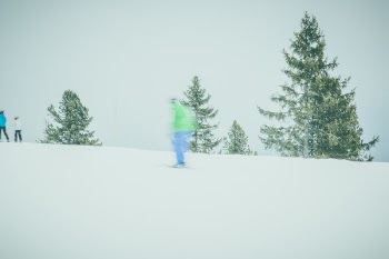 Human in Blue Pants Riding Ski Board