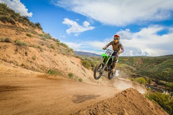 Human Riding Motor and Jumped Under Blue Sky during Daytime