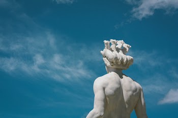 Human Statue Under Clear Sky