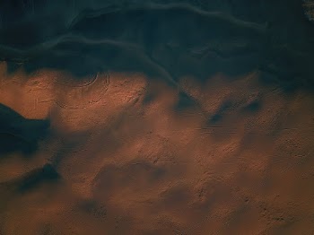 I call this photo “Life on Mars”. I took this with a drone over the Christmas Valley Sand Dunes in central Oregon. This was right as the sun was setting in the high desert and I love how the shadow of this massive sand dune jumps out as the sun slips under the horizon. These sand dunes are pretty remote but worth the trip if you don't mind a long drive and unpaved roads. You can drive right up on the sand dunes if you have all-wheel drive.