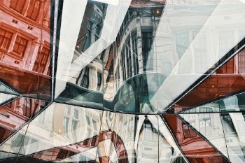 I had visited the Photography exhibition at the V&A musuem in London and upon exiting the courtyard I noticed a glass structure in the floor they had put on. I played around with some angles and managed to get some good reflections which captured nice angles and the buildings in the background.