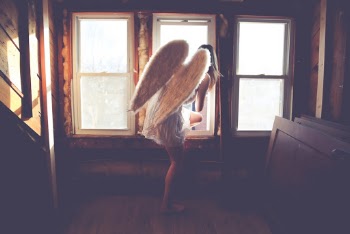 I heard an amazing version of this song ("Fly Away" by Alan Jackson) performed by street musicians the other day, hence the photo... angel wings come handy anytime...