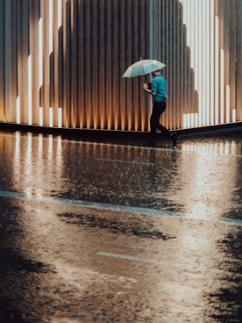 I love the reflection from the floor and the person walking in the middle of the light. 
Actually, I went out to test the focus of the new lens 50mm 1.8 and got this shot.