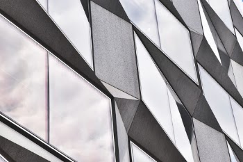 I moved into a new office and can see this building from my office window and immediately the shapes and angles stood out from all others around it. I played around with shots of the full building but taking up the full frame offers a more interesting perspective.