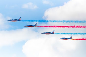 I took this photo at the Paris Air Show while the Patrouille de France made a flying display. They are just perfect aligned. I'm a German but in this moment I was a proud Frenchman.
