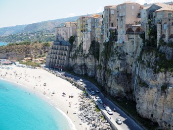 I took this photo in the beautiful Italian town of Tropea, two years ago. The city is towering above the beach, a unique scene!
