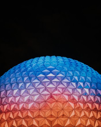 I took this shot while vacationing in Disney World with my wife. Epcot has always been my favorite park due to the magnificent architecture that represents several regions of the world. The Epcot ball is one of the most recognizable pieces of architecture at Disney World and at night it lights up with beautiful vibrant colors. I wanted to capture this moment where the geometric shape and the color all came together!

I used a Sony a7rii with a 35mm 1.4 lens with an ISO of 2500 and shutter speed of 1/125.