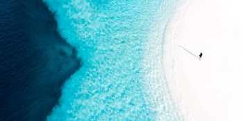 I was so interested in capturing a picture which could fit into any mobile wallpaper.
And after all those tries, Finally i got to see this. 
The very perfect wallpaper of Maldives beach for any mobile device.