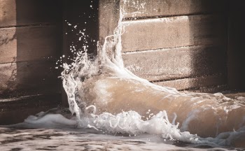 I was staying in Southwold again (my favourite place pretty much anywhere in the world). 
The beach huts are a common thing to photograph (there’s a puncture of them in my unsplash collection) but I’m also fascinated by the breaking waves. 
I like this shot because of the textures in the breakwater and the shadow created by the water droplets.
