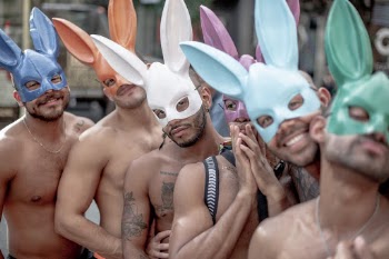I was walking around at Pride 2019 in New York to portrait interesting people and scenes. 

Well.. a group of guys with bunny ears. Obviously, they were up for posing and me up for capturing it.  
