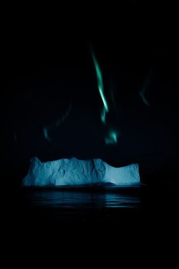 ice berg and aurora borealis