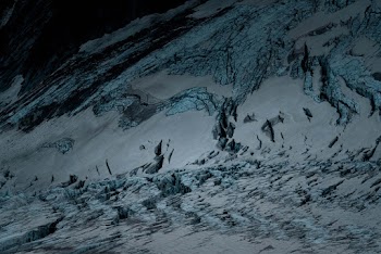 Ice Covers The Slopes Of A Mountain