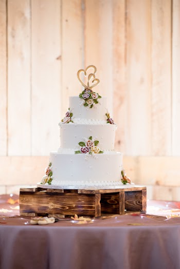 Icing-coated 3-tier Cake on Brown Stand
