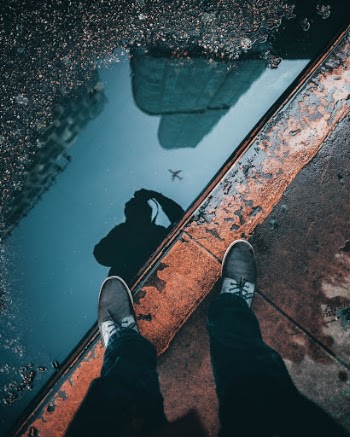 If you wait in certain spots across the Chicagoland area, you are bound to have a plane go directly overhead every 5-10 minutes. I did not have to wait long before this plane crossed perfectly into the puddle that also reflected Trump Tower.