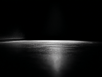 Illuminated Black Floor in Spotlight