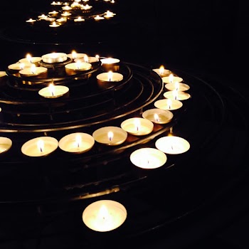 Illuminated Candles on Black Background