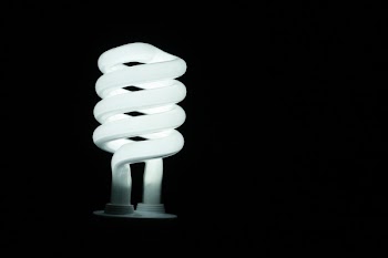 Illuminated Lamp Against Black Background