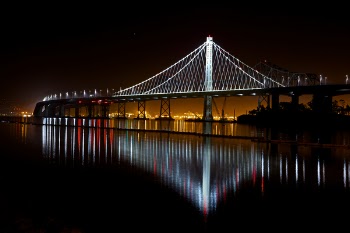 Illuminated Suspension Bridge Against Sky at Night