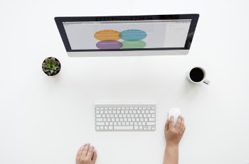 Imac On White Surface Near Apple Keyboard And Magic Mouse 